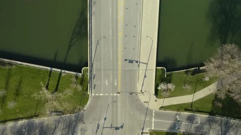 Birds Eye View Above Empty Street Over Pond in Chicago, Illinois, Top Down Stock Footage 130404098