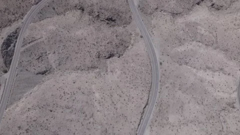 Birds eye view of bend in mountain road Stock Footage 246334500