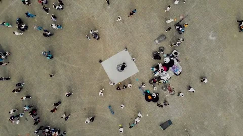 Bird's eye view of breakdance dancer performing street dance on mat surrounded Stock Footage 345602515
