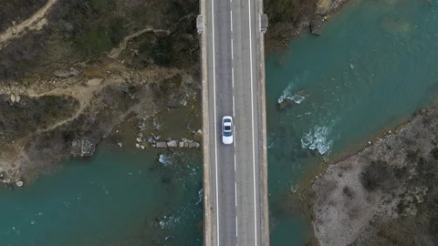 Birds eye view of bridge over fast flowing river, Spain Stock Footage 102513778