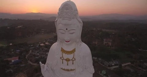 Birds Eye View With Camera Tilt of Guan Yin Statue, Chiang Rai, Thailand Stock Footage 78696018
