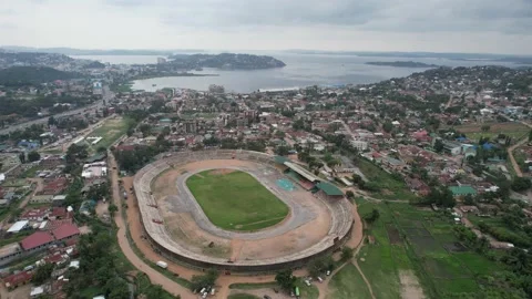 Bird's eye view to the CCM Kirumba Stadium next to Lake Victoria Stock Footage 234065713