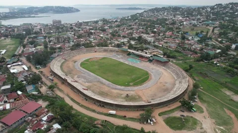 Bird's eye view to the CCM Kirumba Stadium next to Lake Victoria Stock Footage 234065736
