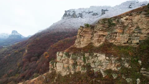 A bird's-eye view of the cliffs. In the distance, the peaks of the mountains Stock Footage 170707583