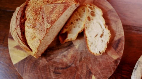 Bird's eye view of country table displaying country loaf of bread, fresh Stock Footage 103342524