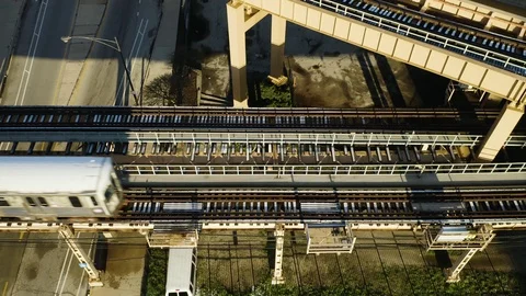 Birds Eye View of CTA Training Passing Over Tracks [4K] Stock Footage 107112282