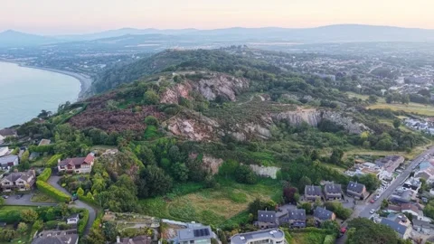 Birds eye view Dalkey Quarry, rugged rocks and residential homes near Dublin Stock Footage 342578116