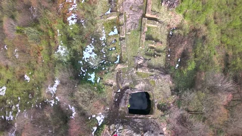 Bird's-Eye View Descending Over Ancient Historic Site and Stone Well Stock Footage 340357565