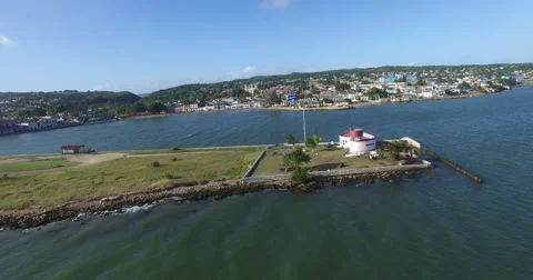 Bird's-eye view from drone to landscape of small peninsula, big building on the Stock Footage 68078490
