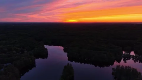 Bird's eye view during an epic sunset at Harold Parker State Forest, surrounded Stock Footage 337125612