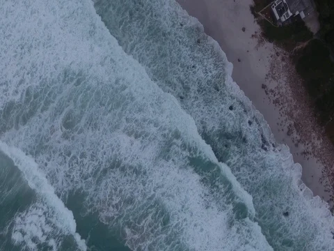 Bird's eye view of eery, misty beach at dawn Video stock 79925230