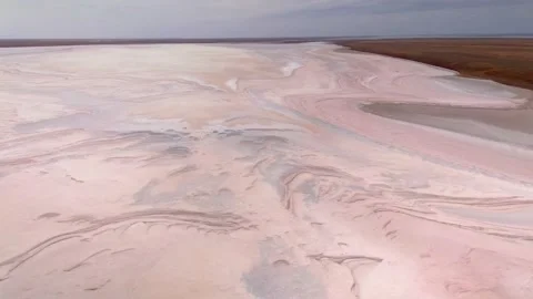 Bird’s eye view endless flat steppe amazing salt lake rose bottom surreal alien  Stock Footage 155841739