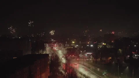 Bird's-eye view of exploding fireworks in the dark sky in Suwalki Stock Footage 242149857