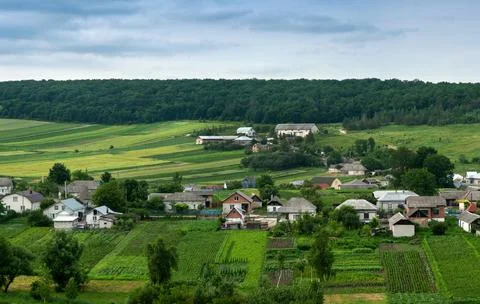 Bird's eye view of fields or farmland and settlements with houses. Stock Photos