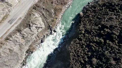 Birds Eye View Following RIver and Road - Queenstown Stock Footage 140423571