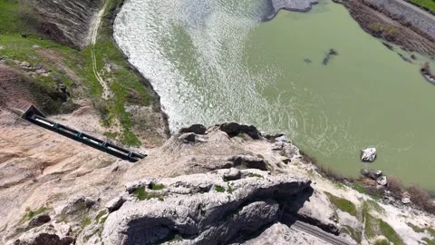 Birds Eye View of Freight Train Entering and Exiting Tunnels Stock-Footage 344745690