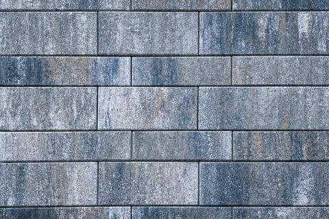 A birds-eye view of a geometric pattern of concrete tiles on a pedestrian Stock Photos