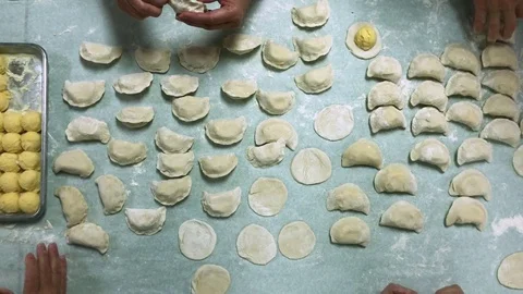 Bird's Eye View of Ladies Pinching Pierogies Stock Footage