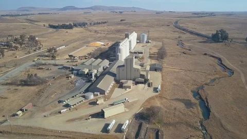 Birds eye view of large grain silo complex set in arid African countryside Stock Footage 79959189
