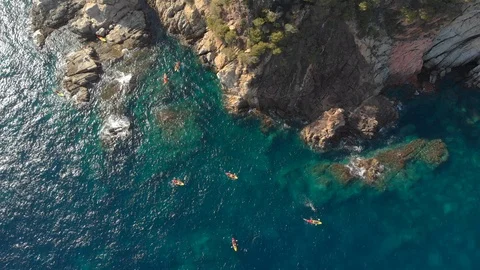 A birds eye view of a large group of kayakers in the Mediterranean Stock Footage 115207890