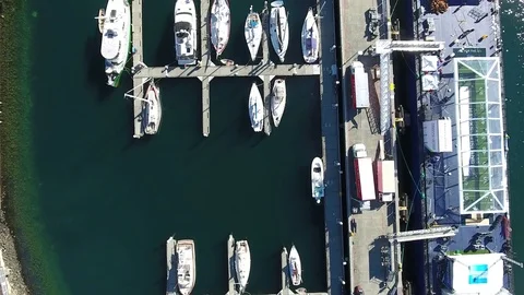 Birds Eye view looking down over ships at Bay 4K Vídeo Stock 71637703