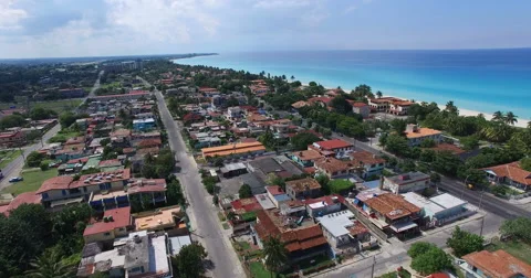 Bird's-eye view to main streets, houses and hotels of Varadero. Drone is flying Video stock 65442415