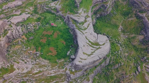 Bird's-Eye View of Massive Rock Formations in a Dramatic Mountain Landscape Stock Footage 341151011