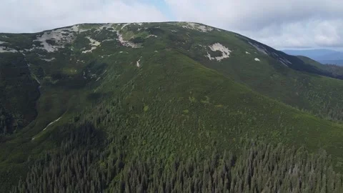 Bird’s eye view of mountain valley with lush green meadow Stock Footage 338104647