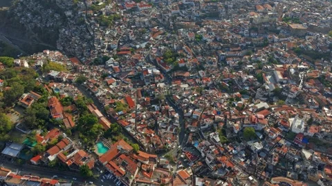 Bird's-eye view of the mountains and hillsides of the town of Taxco on a sunny Stock Footage 332219063