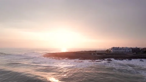 Bird's eye view of ocean waves crashing on rocks Stock Footage 222047337