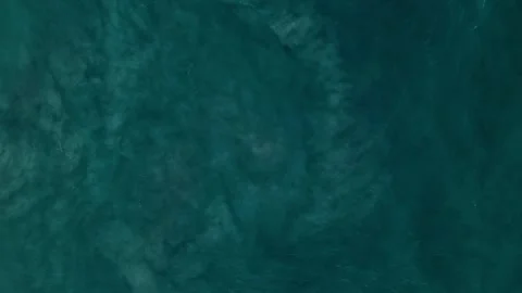 Bird's eye view of the Ocean waves lifting sand from the bottom. Abstraction Stock Footage 266854935