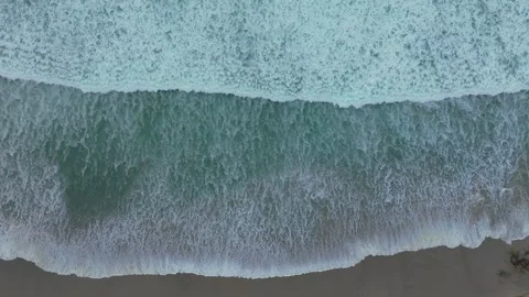 Bird's Eye View Of Ocean Waves Crashing On Beach 動画素材 291528300