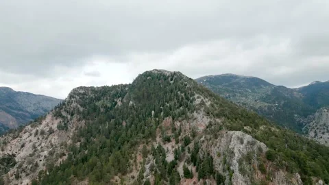 Bird's-eye view over a mountain peak 4k Stock Footage 213617134