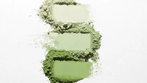 Bird's-eye view of pale green powder smears with changing shadow Stock Footage 337126352