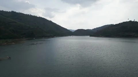 Bird's eye view panoramic over the river lake between the forest and the Stock Footage 280325338