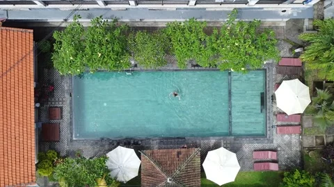BIRDS EYE VIEW OF PLAYING IN POOL Stock Footage 221300052