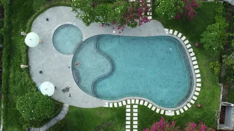 BIRDS EYE VIEW OF PLAYING IN POOL Stock Footage 221304212
