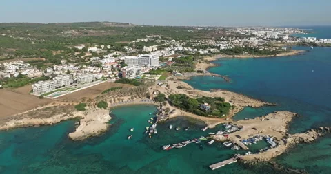 A Bird's-Eye View of Protaras, Cyprus: Seaside Retreats and Stunning Cliffs Stock Footage 248216795