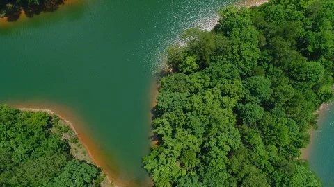 Bird's Eye View of Reflection on Mountain Lake Shoreline Stock Footage 109469887