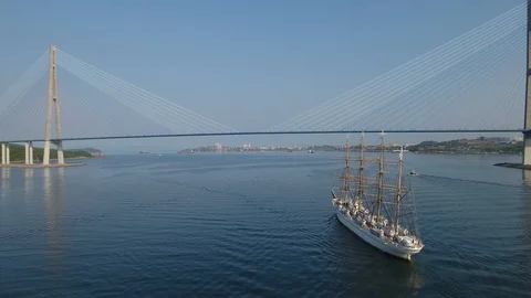 Bird's eye view rigate sails Ship sailboat Russian bridge Vladivostok cityscape  Stock Footage 95120129
