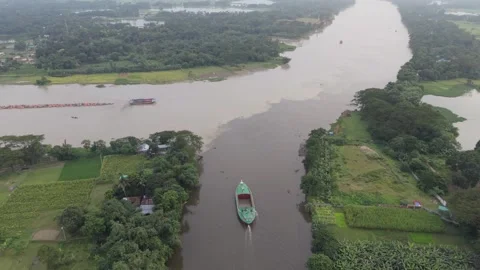 Birds eye view of a river crossing through green countryside Stock Footage 341521445