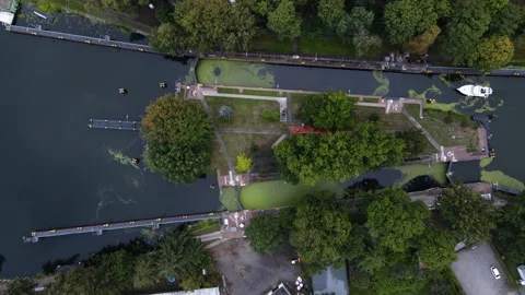 A bird's eye view of the river. Dam. Boats and people. Stock Footage 233819606