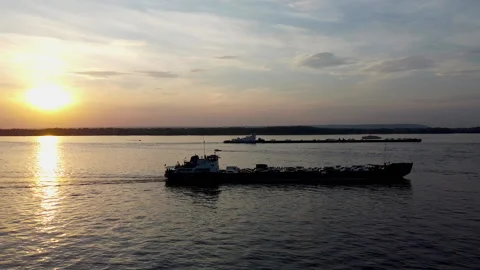 Bird's-eye view of the river, sunset, ferry with cars Stock Footage 134482657