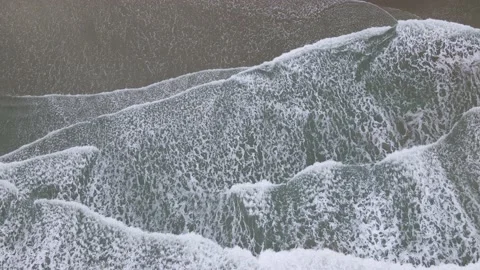 Birds Eye View of Rolling Waves Drone 4k Stock Footage 169006024