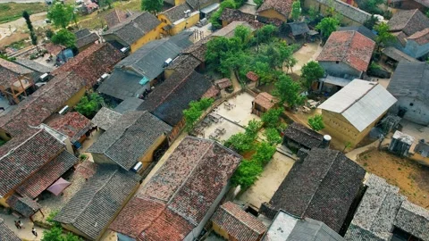 Birds eye view of a rustic village courtyard and organic lifestyle 4K Stock Footage 339045450
