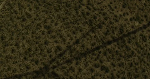 Birds eye view of shadow of wind turbine, foggy day Stock Footage 104705397