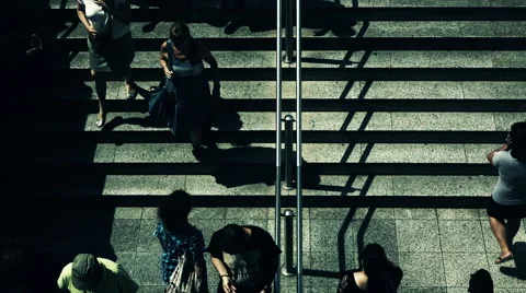 Birds eye view slow motion people walking steps to underground entrance Stock Footage 54520107