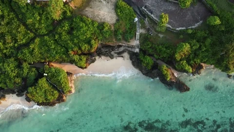 Birds eye view on small beach between cliffs Stock Footage 153348336