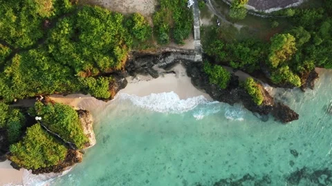 Birds eye view on small beach between cliffs Stock Footage 154360858