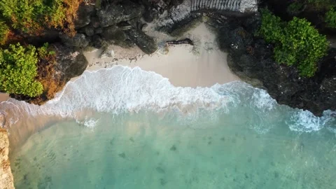 Birds eye view on small beach between cliffs Stock Footage 154424590